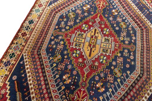Backside of handmade 2000s Shiraz rug showing knot structure and weave density