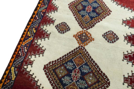 Backside of handmade 2000s Shiraz rug showing knot structure and weave density