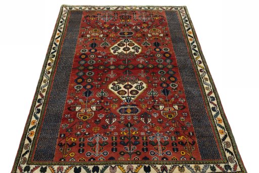 Surface texture of 2000s Shiraz rug with natural Wool and intricate pattern