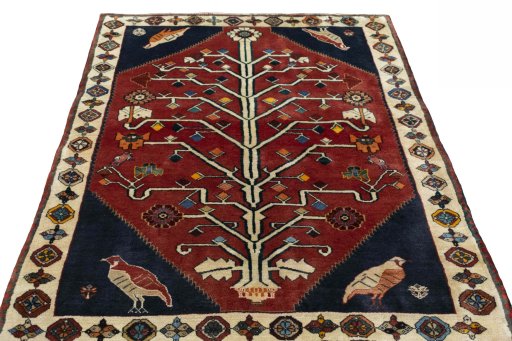 Surface texture of 2000s Shiraz rug with natural Wool and intricate pattern