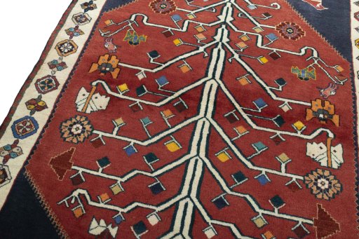 Backside of handmade 2000s Shiraz rug showing knot structure and weave density