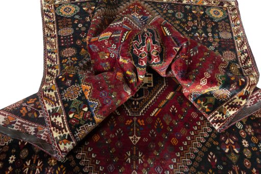Corner detail of 2000s Shiraz rug showing border pattern and Wool pile