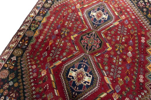 Backside of handmade 2000s Shiraz rug showing knot structure and weave density