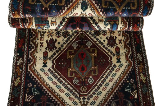 Corner detail of 2000s Shiraz rug showing border pattern and Wool pile