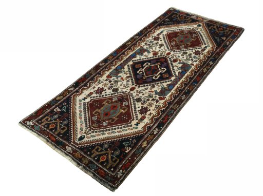 Corner detail of 2000s Shiraz rug showing border pattern and Wool pile