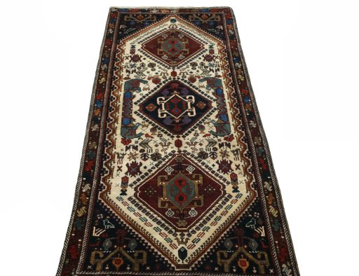 Surface texture of 2000s Shiraz rug with natural Wool and intricate pattern