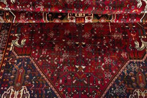 Corner detail of 2000s Shiraz rug showing border pattern and Wool pile