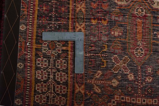 Surface texture of 2000s Shiraz rug with natural Wool and intricate pattern