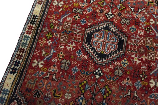 Backside of handmade 2000s Shiraz rug showing knot structure and weave density