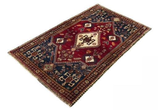 Corner detail of 2000s Shiraz rug showing border pattern and Wool pile