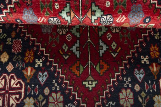 Corner detail of 2000s Shiraz rug showing border pattern and Wool pile