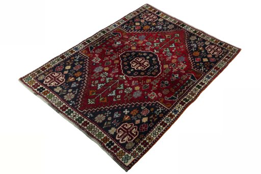 Corner detail of 2000s Shiraz rug showing border pattern and Wool pile