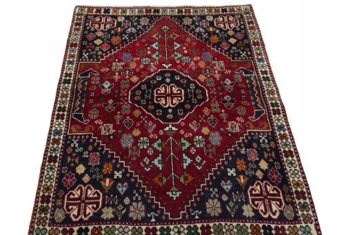 Surface texture of 2000s Shiraz rug with natural Wool and intricate pattern