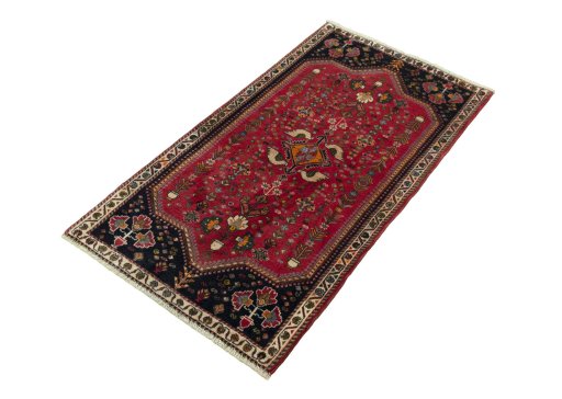 Corner detail of 2000s Shiraz rug showing border pattern and Wool pile