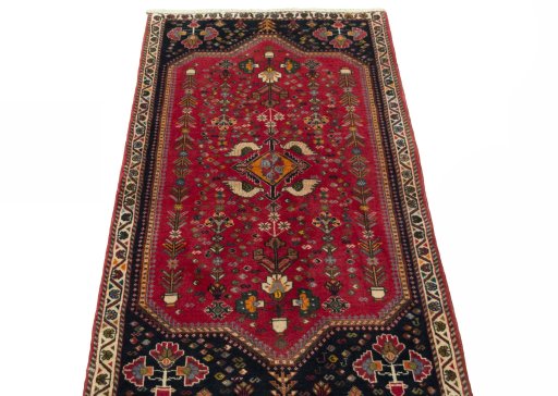 Surface texture of 2000s Shiraz rug with natural Wool and intricate pattern