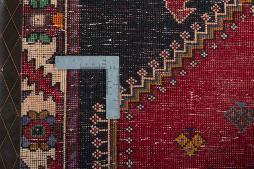 Surface texture of 2000s Shiraz rug with natural Wool and intricate pattern