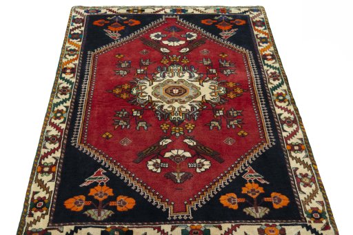 Surface texture of 2000s Shiraz rug with natural Wool and intricate pattern