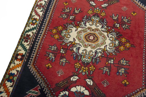 Backside of handmade 2000s Shiraz rug showing knot structure and weave density