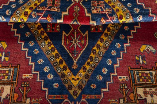 Corner detail of 2000s Shiraz rug showing border pattern and Wool pile