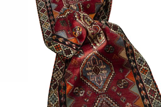 Corner detail of 2000s Shiraz rug showing border pattern and Wool pile