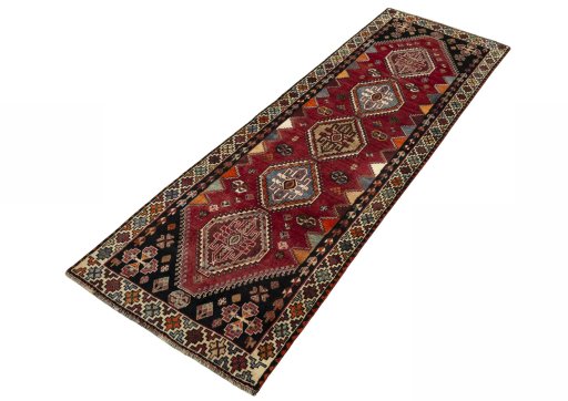 Corner detail of 2000s Shiraz rug showing border pattern and Wool pile
