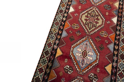Backside of handmade 2000s Shiraz rug showing knot structure and weave density