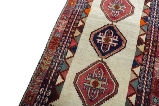 Backside of handmade 2000s Shiraz rug showing knot structure and weave density