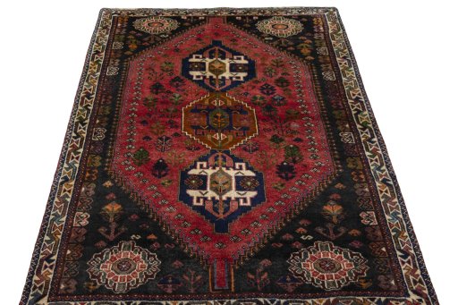 Surface texture of 2000s Shiraz rug with natural Wool and intricate pattern