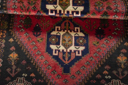Full view of 2000s Shiraz rug from Iran / Persia, 188 × 127 cm in Red tones