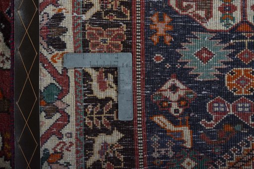 Backside of handmade 2000s Shiraz rug showing knot structure and weave density