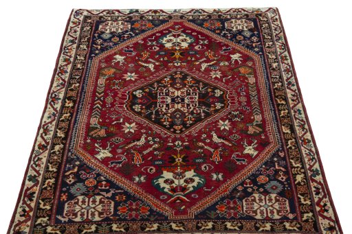 Surface texture of 2000s Shiraz rug with natural Wool and intricate pattern