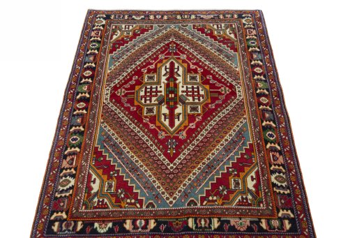 Surface texture of 1970s Shiraz rug with natural Wool and intricate pattern