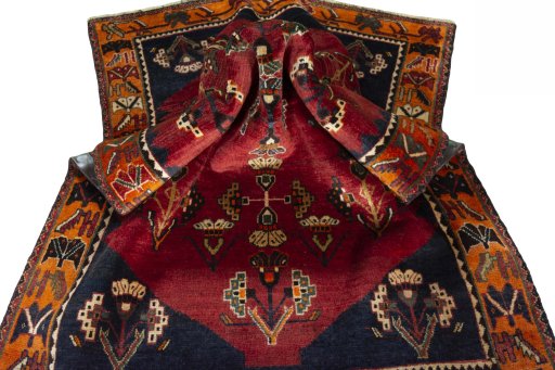 Corner detail of 2000s Shiraz rug showing border pattern and Wool pile