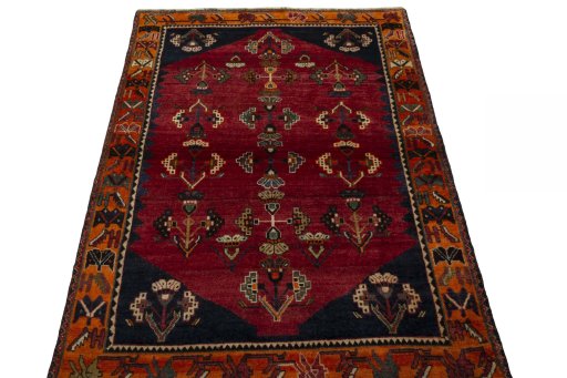 Surface texture of 2000s Shiraz rug with natural Wool and intricate pattern