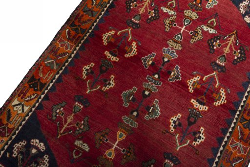 Backside of handmade 2000s Shiraz rug showing knot structure and weave density