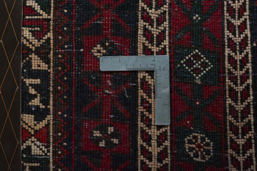 Corner detail of 2000s Shiraz rug showing border pattern and Wool pile