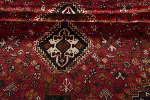 Corner detail of 1970s Shiraz rug showing border pattern and Wool pile