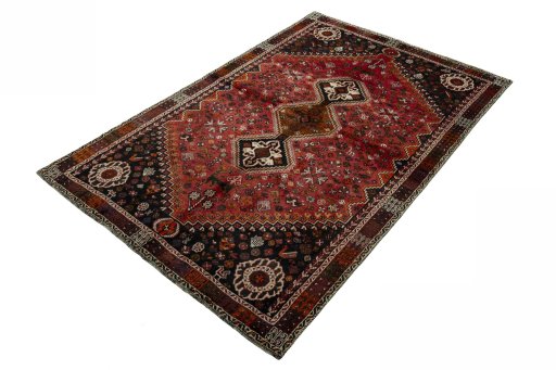 Corner detail of 1970s Shiraz rug showing border pattern and Wool pile