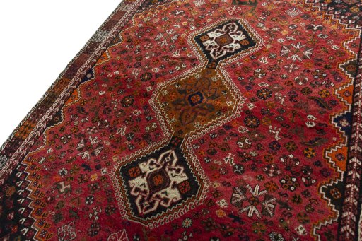 Backside of handmade 1970s Shiraz rug showing knot structure and weave density