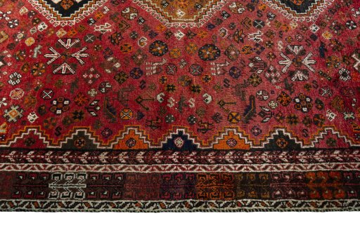 Full view of 1970s Shiraz rug from Iran / Persia, 281 × 177 cm in Red tones