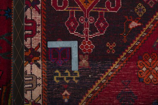 Surface texture of 2000s Shiraz rug with natural Wool and intricate pattern
