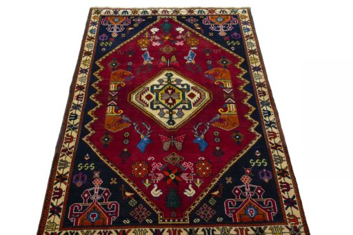Surface texture of 2000s Shiraz rug with natural Wool and intricate pattern