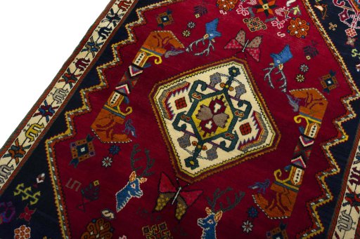 Backside of handmade 2000s Shiraz rug showing knot structure and weave density