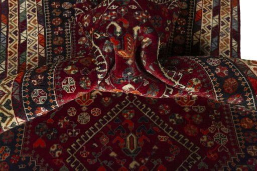 Corner detail of 2000s Shiraz rug showing border pattern and Wool pile
