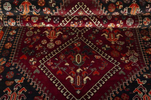 Full view of 2000s Shiraz rug from Iran / Persia, 222 × 157 cm in Red tones