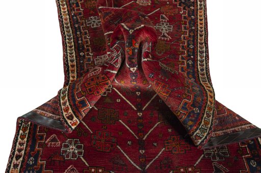 Corner detail of 2000s Shiraz rug showing border pattern and Wool pile