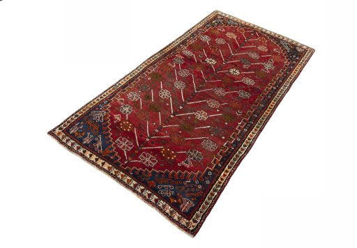 Corner detail of 2000s Shiraz rug showing border pattern and Wool pile