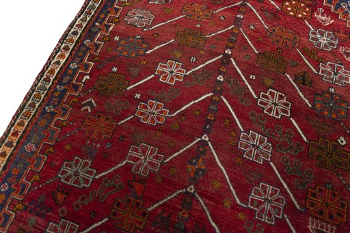 Backside of handmade 2000s Shiraz rug showing knot structure and weave density