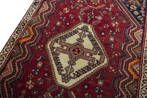 Backside of handmade 2000s Shiraz rug showing knot structure and weave density