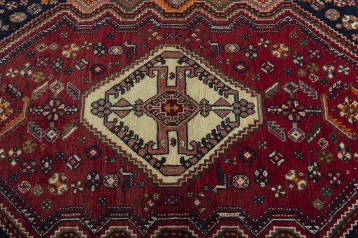 Central medallion detail of 2000s Shiraz rug from Iran / Persia